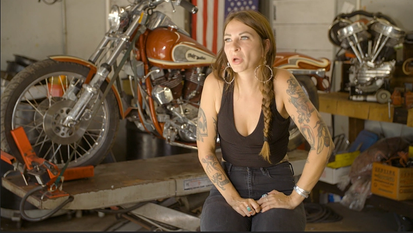 Woman speaking in a bikeshop