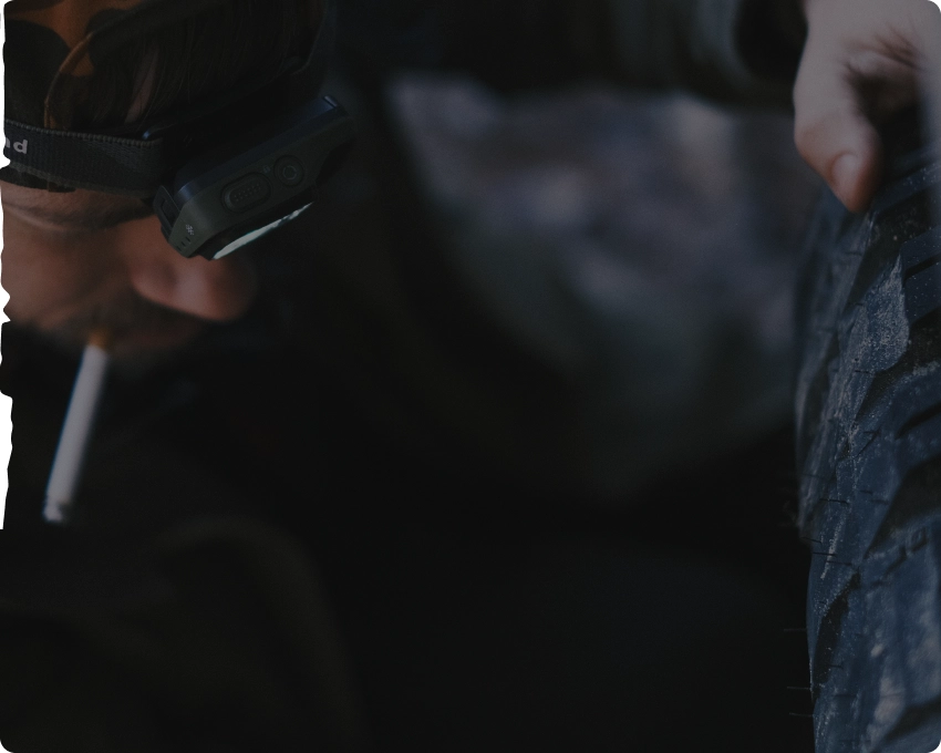 Man smoking with a headlamp on