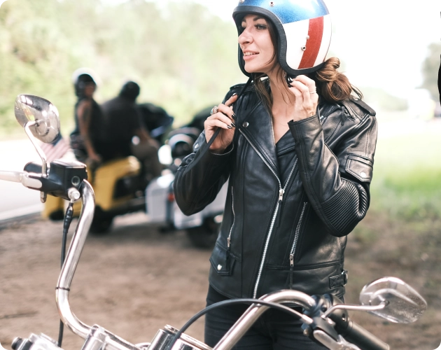 Biker putting on Helmet